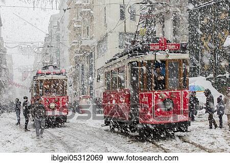 Stock Photo - Tram under sleet on Istiklal Street, Beyoglu, Turkey on January 10, 2017. Fotosearch
