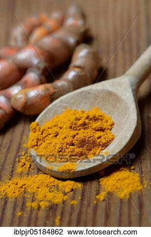 Stock Image - Turmericpowder and ( Curcuma longa) salsify. Fotosearch