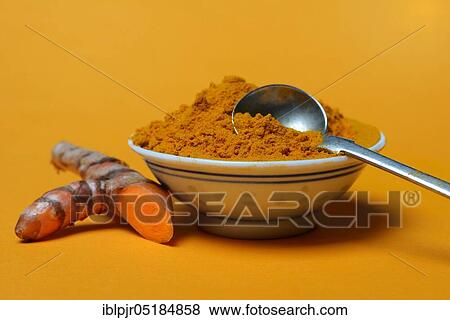 Stock Photo - Turmericpowder in bowl and ( Curcuma longa) salsify. Fotosearch