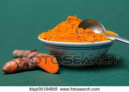 Stock Photo - Turmericpowder in bowl and ( Curcuma longa) salsify. Fotosearch