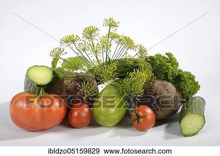 Stock Photo - Various vegetables, cucumber, tomatoes (Solanum lycopersicum), basil (Ocimum basilicum), parsley (Petroselinum crispum), dill (Anethum graveolens), beetroot (Beta vulgaris), snake cucumber (Cucumis sativus), cucumber, tomato. Fotosearch