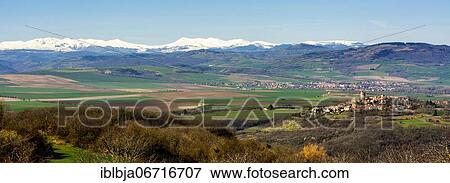 Stock Photo - Village of Montpeyroux and view on Sancy massif in winter, labelled Les Plus Beaux Villages de France, Puy de Dome department, Auvergne-Rhone-Alpes, France, Europe. Fotosearch