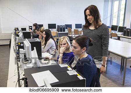 Vocational school students in class at the computer. Dual system at the Elly-Heuss-Knapp-Schule, a vocational college of the city of Düsseldorf, North Rhine-Westphalia, Germany, Europe View Large Photo Image Stock Photo - Vocational school students in class at the computer. Dual system at the Elly-Heuss-Knapp-Schule, a vocational college of the city of Düsseldorf, North Rhine-Westphalia, Germany, Europe. Fotosearch