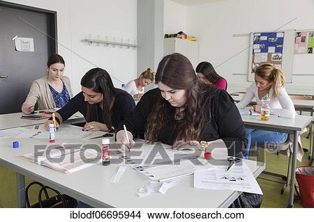 Picture - Vocational school students in class of the vocational training to become a beautician. Dual system at the Elly-Heuss-Knapp-Schule, a vocational college of the city of Düsseldorf, North Rhine-Westphalia, Germany, Europe. Fotosearch