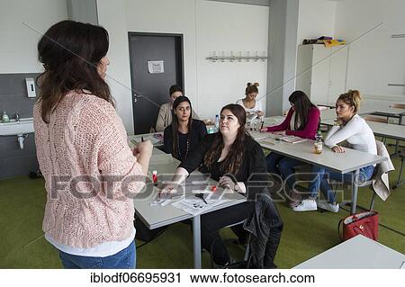 Vocational school students in class of the vocational training to become a beautician. Dual system at the Elly-Heuss-Knapp-Schule, a vocational college of the city of Düsseldorf, North Rhine-Westphalia, Germany, Europe View Large Photo Image Stock Image - Vocational school students in class of the vocational training to become a beautician. Dual system at the Elly-Heuss-Knapp-Schule, a vocational college of the city of Düsseldorf, North Rhine-Westphalia, Germany, Europe. Fotosearch