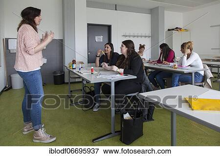 Stock Photo - Vocational school students in class of the vocational training to become a beautician. Dual system at the Elly-Heuss-Knapp-Schule, a vocational college of the city of Düsseldorf, North Rhine-Westphalia, Germany, Europe. Fotosearch