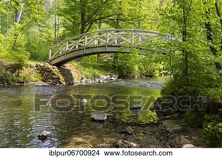 Picture - White arch bridge over the river Große Röder, Seifersdorfer Tal, Wachau, Saxony, Germany, Europe. Fotosearch