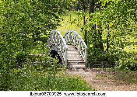 Stock Photography - White arch bridge over the river Große Röder, Seifersdorfer Tal, Wachau, Saxony, Germany, Europe. Fotosearch