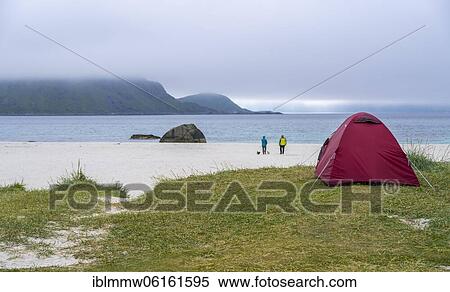 Stock Photography - Wild camping at Hauklandstranda, beach by the sea with tent, Lofoten, Nordland, Norway, Europe. Fotosearch