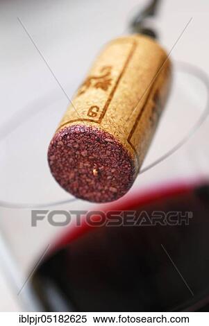 Stock Photography - Wine cork and glass of red wine, cork. Fotosearch