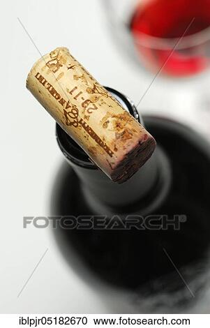 Stock Image - Wine cork on red wine bottle, cork, red wine, bottle. Fotosearch