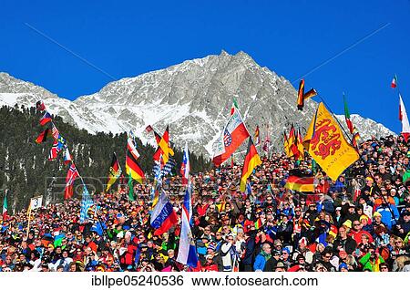 Stock Photograph - Winter sports, spectators, grandstand, biathlon, Antholz, Pustertal, South Tyrol, Italy, Europe. Fotosearch