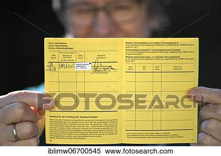 Woman proudly showing her vaccination certificate after being vaccinated with AstraZeneca against Covid-19, Sars-CoV-2, Corona crisis, Stuttgart, Baden-Württemberg, Germany, Europe View Large Photo Image Stock Photography - Woman proudly showing her vaccination certificate after being vaccinated with AstraZeneca against Covid-19, Sars-CoV-2, Corona crisis, Stuttgart, Baden-Württemberg, Germany, Europe. Fotosearch