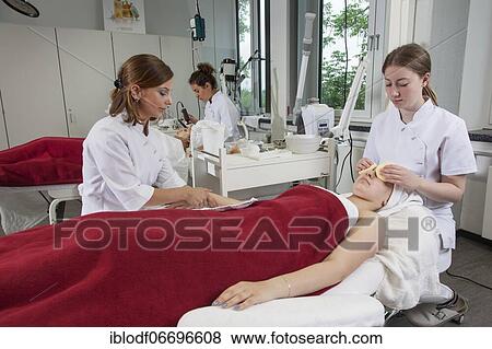 Stock Photo - Work on models with cleansing sponges in practical lessons. Training as a beautician at the vocational school, Düsseldorf, North Rhine-Westphalia, Germany, Europe. Fotosearch