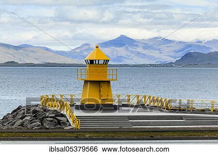 Stock Photograph - Yellow lighthouse in the old city harbour, Reykjavik, Iceland, Europe. Fotosearch