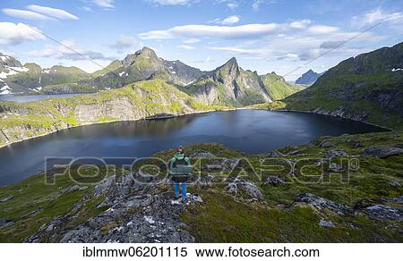 Young woman with backpack, mountain landscape with lake Tennesvatnet, hiking to Munken, Moskenesöy, Lofoten, Nordland, Norway, Europe View Large Photo Image Stock Photography - Young woman with backpack, mountain landscape with lake Tennesvatnet, hiking to Munken, Moskenesöy, Lofoten, Nordland, Norway, Europe. Fotosearch