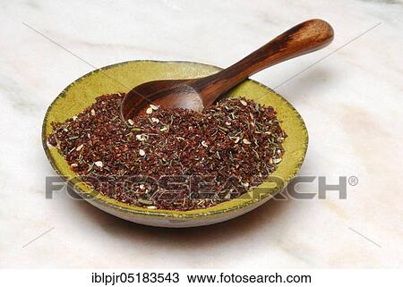 Stock Image - Zaatar, Za'atar, Zatar, Zahtar, spice mixture of sumac, sesame seeds, thyme, salt, North African cuisine, Oriental cuisine, Arabia. Fotosearch