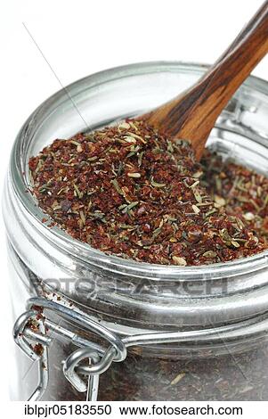 Stock Image - Zaatar, Za'atar, Zatar, Zahtar, spice mixture of sumac, sesame seeds, thyme, salt, North African cuisine, Oriental cuisine, Arabia. Fotosearch