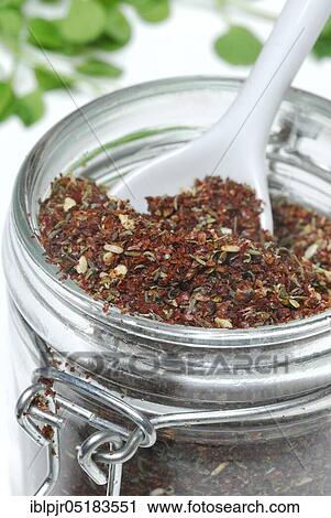 Stock Image - Zaatar, Za'atar, Zatar, Zahtar, spice mixture of sumac, sesame seeds, thyme, salt, North African cuisine, Oriental cuisine, Arabia. Fotosearch