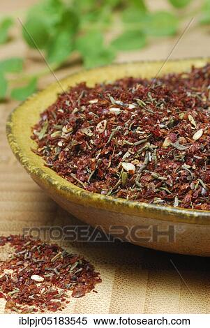 Stock Photography - Zaatar, Za'atar, Zatar, Zahtar, spice mixture of sumac, sesame seeds, thyme, salt, North African cuisine, Oriental cuisine, Arabia. Fotosearch