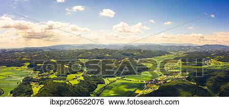 Aerial panorama of green hills and vineyards, Kitzeck im Sausal, Austria, Europe View Large Photo Image Stock Photograph - Aerial panorama of green hills and vineyards, Kitzeck im Sausal, Austria, Europe. Fotosearch