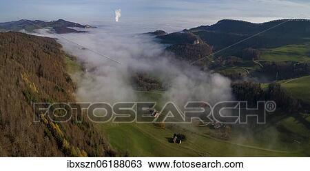 Aerial view Ifleter Berg with view to Ifenthal, the sea of fog in the midlands and the steam cloud from the nuclear power plant Gösgen, Solothurn, Switzerland, Europe View Large Photo Image Stock Image - Aerial view Ifleter Berg with view to Ifenthal, the sea of fog in the midlands and the steam cloud from the nuclear power plant Gösgen, Solothurn, Switzerland, Europe. Fotosearch