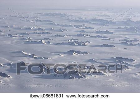 Aerial view, inland ice, ice sheet with glaciated mountain ranges, Greenland, North America View Large Photo Image Stock Image - Aerial view, inland ice, ice sheet with glaciated mountain ranges, Greenland, North America. Fotosearch