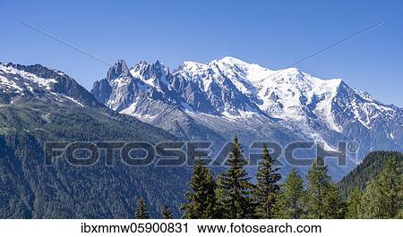 Stock Image - Aiguille du Midi and Mont Blanc with glacier Glacier de Bossons, Chamonix, Haute-Savoie, France, Europe. Fotosearch