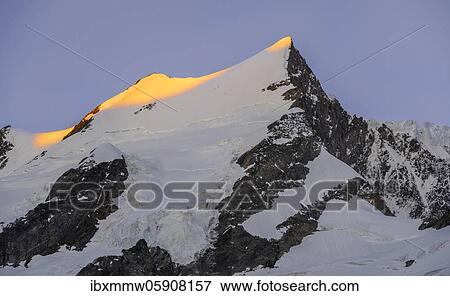 Alpenglow, first sunlight, summit of the Großer Fiescherhorn, Bernese Oberland, Switzerland, Europe View Large Photo Image Stock Photo - Alpenglow, first sunlight, summit of the Großer Fiescherhorn, Bernese Oberland, Switzerland, Europe. Fotosearch