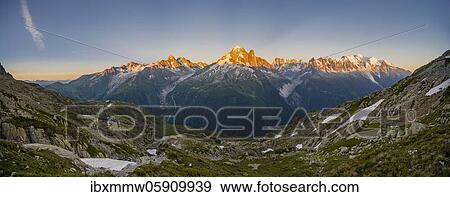 Alpine glow, mountain panorama, Mer de Glace and Glacier d'Argentière, Aiguille Verte, Aiguille du Midi, Aiguille du Moine, Mont Blanc, Grandes Jorasses, Mont Blanc massif, Chamonix-Mont-Blanc, Haute-Savoie, France, Europe View Large Photo Image Stock Photo - Alpine glow, mountain panorama, Mer de Glace and Glacier d'Argentière, Aiguille Verte, Aiguille du Midi, Aiguille du Moine, Mont Blanc, Grandes Jorasses, Mont Blanc massif, Chamonix-Mont-Blanc, Haute-Savoie, France, Europe. Fotosearch