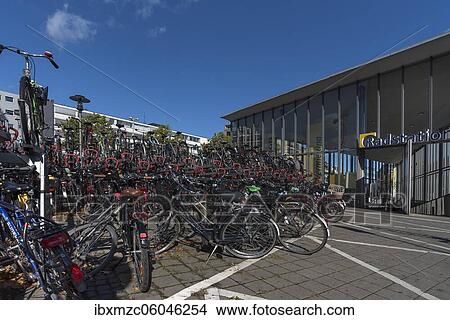 Bikes in front of the bike station, parking for bikes, in front of the main station, Münster, North Rhine-Westphalia, Germany, Europe View Large Photo Image Picture - Bikes in front of the bike station, parking for bikes, in front of the main station, Münster, North Rhine-Westphalia, Germany, Europe. Fotosearch