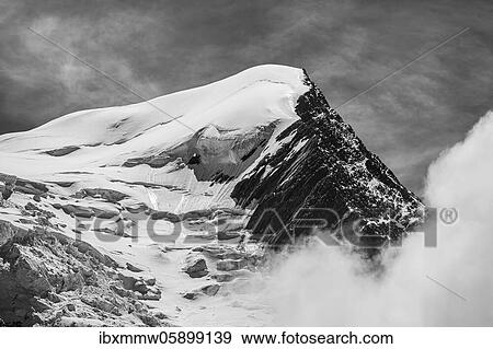 Black and white, high alpine mountain landscape, peak Aiguille du Goûter with glacier, Glacier de Taconnaz, behind Mont Blanc, Chamonix, Haute-Savoie, France, Europe View Large Photo Image Stock Photo - Black and white, high alpine mountain landscape, peak Aiguille du Goûter with glacier, Glacier de Taconnaz, behind Mont Blanc, Chamonix, Haute-Savoie, France, Europe. Fotosearch