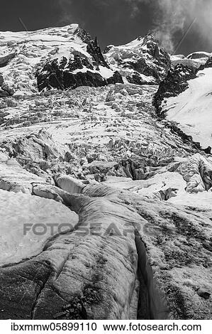 Black and white, La Jonction, glacier tongue, Glacier des Bossons meets Glacier de Taconnaz, summit of Mont Maudit, Mont Blanc and Aiguille de Bionnassay, Chamonix, Haute-Savoie, France, Europe View Large Photo Image Stock Image - Black and white, La Jonction, glacier tongue, Glacier des Bossons meets Glacier de Taconnaz, summit of Mont Maudit, Mont Blanc and Aiguille de Bionnassay, Chamonix, Haute-Savoie, France, Europe. Fotosearch