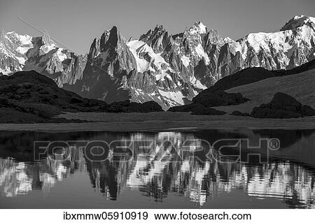 Black and white, mountain panorama with water reflection in Lac Blanc, mountain peaks, Grandes Jorasses and Mont Blanc massif, Chamonix-Mont-Blanc, Haute-Savoie, France, Europe View Large Photo Image Stock Photo - Black and white, mountain panorama with water reflection in Lac Blanc, mountain peaks, Grandes Jorasses and Mont Blanc massif, Chamonix-Mont-Blanc, Haute-Savoie, France, Europe. Fotosearch