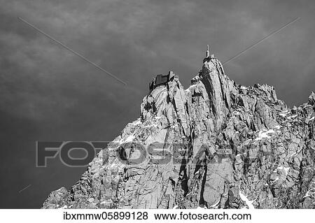 Stock Photo - Black and white, mountain top in clouds, mountain station of the cable car, Aiguille du Midi, Chamonix, Haute-Savoie, France, Europe. Fotosearch