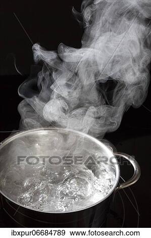 Boiling water in a saucepan, rising steam View Large Photo Image Stock Photo - Boiling water in a saucepan, rising steam. Fotosearch