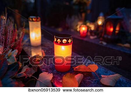 Burning grave light on a grave, Germany, Europe View Large Photo Image Stock Photo - Burning grave light on a grave, Germany, Europe. Fotosearch