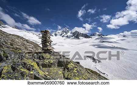 Stock Image - Cairns on the hiking trail, Glacier du Tour, glacier and mountain peaks, high alpine landscape, left Aiguille du Chardonnet, Chamonix, Haute-Savoie, France, Europe. Fotosearch