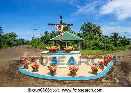 Christian statue at a road bend, Wallis, Wallis and Futuna, Oceania View Large Photo Image Stock Photography - Christian statue at a road bend, Wallis, Wallis and Futuna, Oceania. Fotosearch