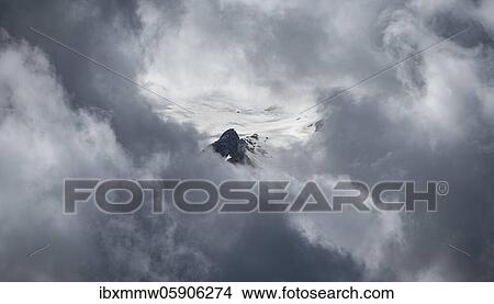 Picture - Cloudy glacier with rocks, high alpine landscape, Chamonix, Haute-Savoie, France, Europe. Fotosearch