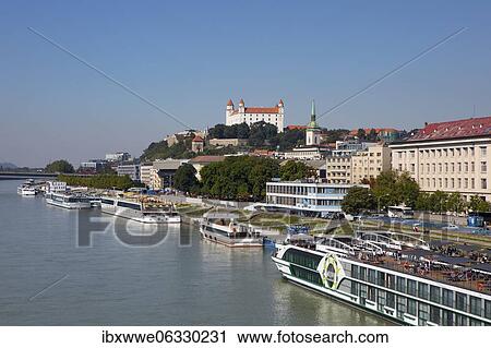 Cruise ship pier with view to Bratislava Castle, Danube, Bratislava, Slovakia, Europe View Large Photo Image Stock Image - Cruise ship pier with view to Bratislava Castle, Danube, Bratislava, Slovakia, Europe. Fotosearch