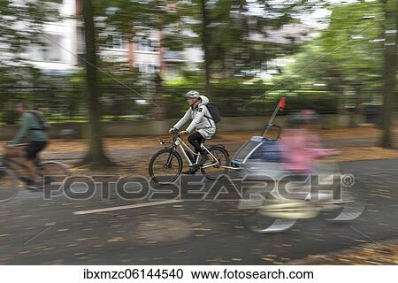Cyclists on the bicycle road of the Promenade, Münster, North Rhine-Westphalia, Germany, Europe View Large Photo Image Stock Image - Cyclists on the bicycle road of the Promenade, Münster, North Rhine-Westphalia, Germany, Europe. Fotosearch