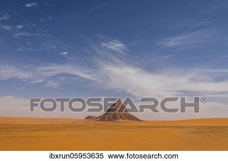 Desert scenery with striking rock, Sahara, North of Chad View Large Photo Image Stock Photography - Desert scenery with striking rock, Sahara, North of Chad. Fotosearch