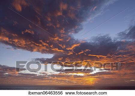 Dramatic cloudy sky, evening mood at the sea, La Gomera, Canary Islands, Spain, Europe View Large Photo Image Stock Photograph - Dramatic cloudy sky, evening mood at the sea, La Gomera, Canary Islands, Spain, Europe. Fotosearch