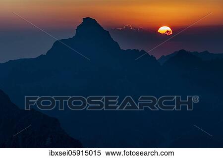 Dramatic sunset with summit of the Hochvogel, Elmen, Allgäuer Alps, Außerfern, Tyrol, Austria, Europe View Large Photo Image Stock Photography - Dramatic sunset with summit of the Hochvogel, Elmen, Allgäuer Alps, Außerfern, Tyrol, Austria, Europe. Fotosearch