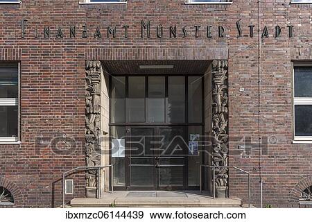 Stock Photo - Entrance from the former, historical tax office Münster Stadt, built around 1920, Münster, North Rhine-Westphalia, Germany, Europe. Fotosearch