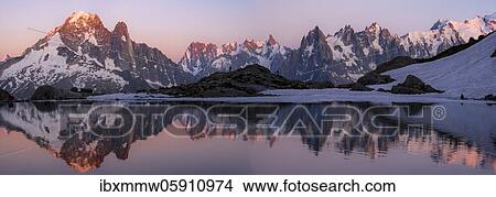Evening atmosphere with alpenglow, water reflection in Lac Blanc, mountain peaks, Aiguille Verte, Grandes Jorasses, Aiguille du Moine, Mont Blanc, Mont Blanc massif, Chamonix-Mont-Blanc, Haute-Savoie, France, Europe View Large Photo Image Picture - Evening atmosphere with alpenglow, water reflection in Lac Blanc, mountain peaks, Aiguille Verte, Grandes Jorasses, Aiguille du Moine, Mont Blanc, Mont Blanc massif, Chamonix-Mont-Blanc, Haute-Savoie, France, Europe. Fotosearch