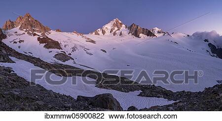 Stock Image - Evening mood, Glacier du Tour, Glacier and mountain peaks, High alpine landscape, Tête Blanche, Petite and Grande Fourche on the left, Aiguille du Chardonnet in the middle, Chamonix, Haute-Savoie, France, Europe. Fotosearch