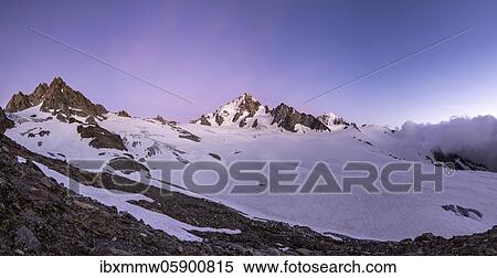 Stock Photography - Evening mood, Glacier du Tour, Glacier and mountain peaks, High alpine landscape, Tête Blanche, Petite and Grande Fourche on the left, Aiguille du Chardonnet in the middle, Chamonix, Haute-Savoie, France, Europe. Fotosearch