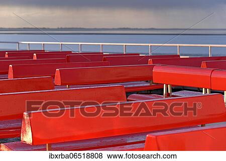 Ferry, outer deck with red benches, approaching rain front, North Sea, North Sea coast, Norddeich, Lower Saxony, Germany, Europe View Large Photo Image Stock Photo - Ferry, outer deck with red benches, approaching rain front, North Sea, North Sea coast, Norddeich, Lower Saxony, Germany, Europe. Fotosearch